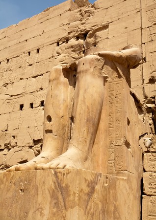 legs of damaged Egyptian statue in Karnak Temple, Luxor, Egyptの写真素材