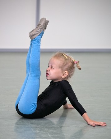 little gymnast girl in gymの写真素材