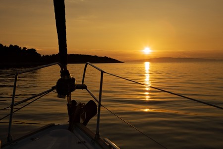 sunset seascape view from yacht noseの写真素材