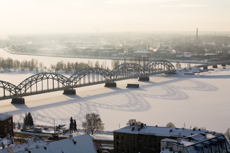 winter aerial view of Riga town with big metal bridge over Daugava riverの写真素材