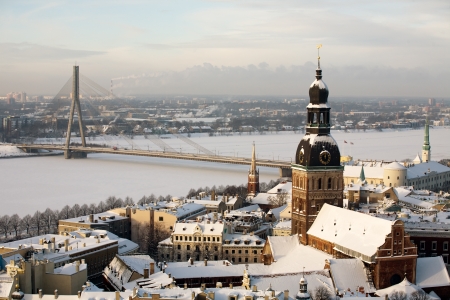 beautiful winter aerial panorama of Riga town with big cable bridge over Daugava riverの写真素材