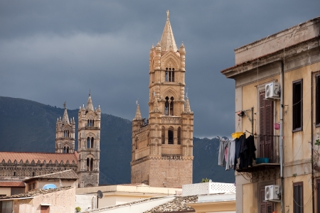 view of Palermo with houses and old tracery towers of Cathedral, Sicily, Italyの写真素材