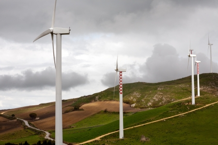 summer landscape with wind turbines on green hills, Italy, Sicily