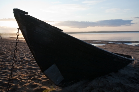 old wooden boat closeup on sea shore evening twilight の写真素材