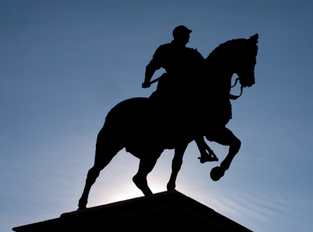 black silhouette of equestrian statue Bartolomeo Colleoni by Verrocchio in Venice on blue sky backgroundの写真素材