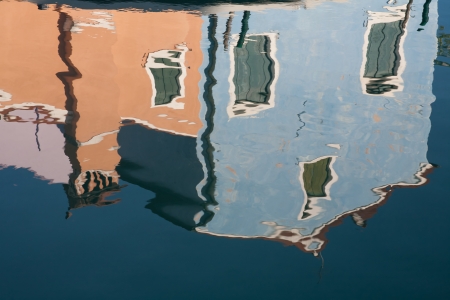 water reflection of small colored house in Burano island, Venice, Italyの写真素材