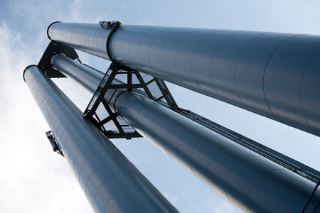 big industrial pump tube closeup on sky backgroundの写真素材