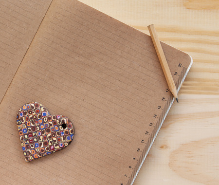 Color heart lying on the notebook, Valentineの写真素材