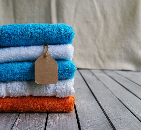 stack of towels with a price tag close upの写真素材