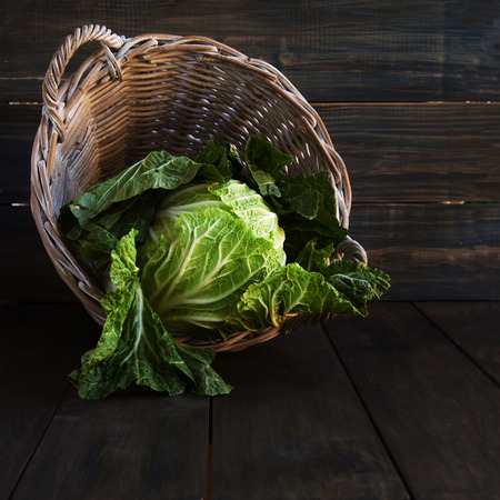 cabbage in a basket, rustic, wuuden tableの写真素材