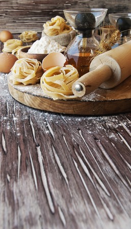 raw pasta with ingredients for cooking, selective focusの写真素材
