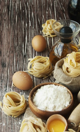 raw pasta with ingredients for cooking, selective focusの写真素材