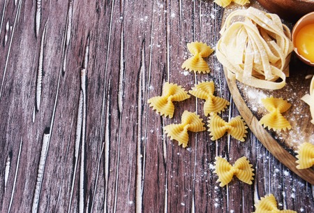 raw pasta with ingredients for cooking, selective focusの写真素材