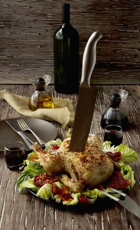 raw chicken with herbs spices ingredients, ready for cooking, on a wooden table, selective focusの写真素材