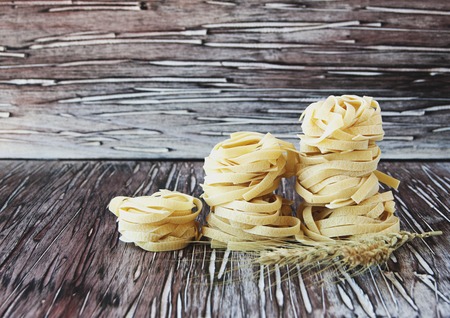 raw pasta with ingredients for cooking, selective focusの写真素材