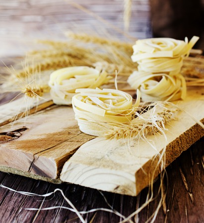 raw pasta with ingredients for cooking, selective focusの写真素材