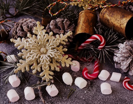 Christmas decoration with fir branches, tangerines, pine cones, and decoration elements , selective focusの写真素材