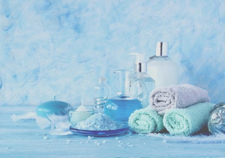 Set for spa with towels, salt and aromatic oils, selective focusの写真素材