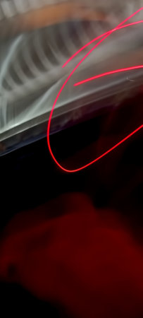 Red light trails on a black background, close-up. Horizontal photoの写真素材