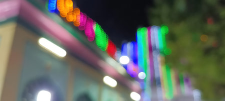 blurred lights of city traffic. Blurred Christmas lights background with festive gold holiday bokeh. Bunch of various unfocusedの写真素材