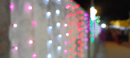 blurred lights of city traffic. Blurred Christmas lights background with festive gold holiday bokeh. Bunch of various unfocusedの写真素材
