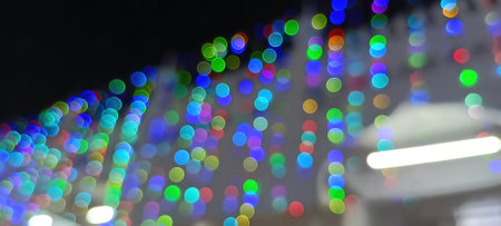 Black background with golden light effects. Horizontal background with blur bokeh effects for...