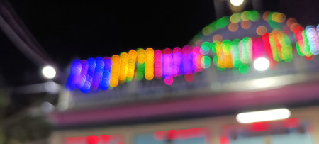 Black background with golden light effects. Horizontal background with blur bokeh effects for Christmas time. Color light overlayの写真素材