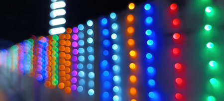 circular reflections of lights abstract blurred of red and gold glittering shine bulbs lights background. defocused golden lightsの写真素材