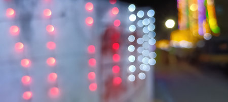 Bright glowing lights of city and traffic under dark light in evening on blurred city lights. light...