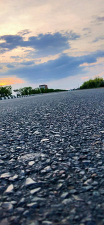 Asphalt road in the evening, close-up. Abstract backgroundの写真素材