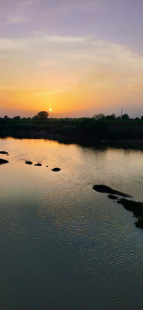 Sunset on the river at the edge of the forest in Thailandの写真素材