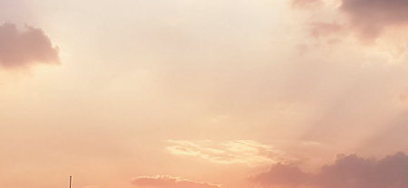Sunset sky background with tiny clouds. Panoramic image.の写真素材