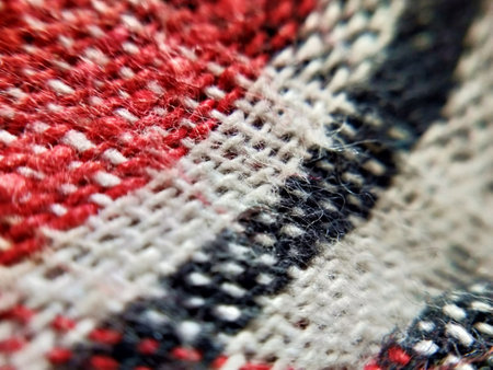 Detail of a woolen fabric with red and white stripes.の写真素材
