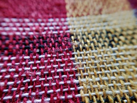 Close up detail of a red and white hand woven woolen fabricの写真素材