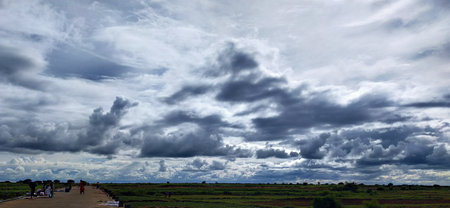 Cloudy sky over the river.の写真素材