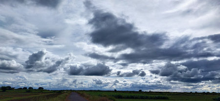 Storm clouds over the field. Panoramic view of the countryside.の写真素材