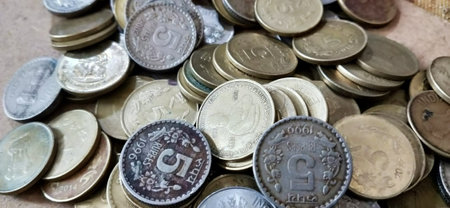 Coins of different countries on the table. Selective focus.