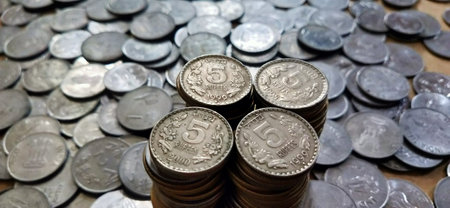 Coins of Thai baht currency on the background of coins