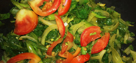 stir-fried vegetables in a wok, close-up