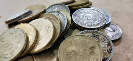 Close up of old coins on the table. Selective focus.