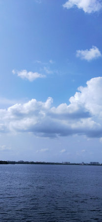 Beautiful blue sky with white clouds over the sea. Nature background.の写真素材