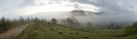 Misty daybreak in autumn Carpathian mountain, Ukraine. Ten shots stitch image.の写真素材