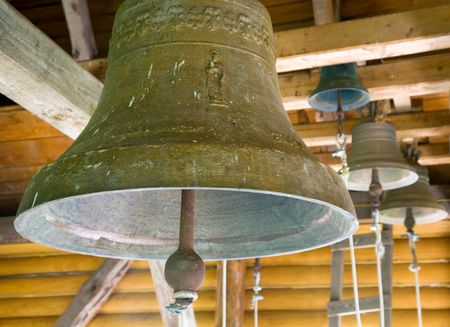 Church bells under the roof of christian monasteryの写真素材