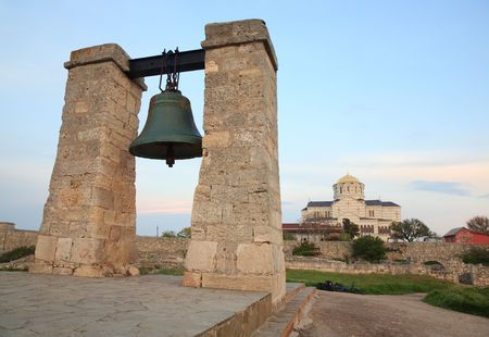 Evening the bell of Chersonesos (ancient town) and St Vladimir's Cathedral (Sevastopol, Crimea, Ukraine)の写真素材
