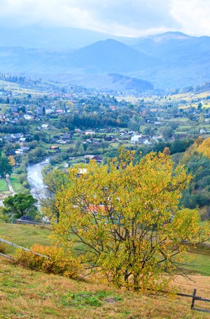 beautiful autumn mountain and small village on mountainside (Carpathian. Ukraine)の写真素材