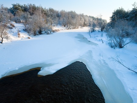 Beautiful evening  calm  view of winter river from bridgeの写真素材