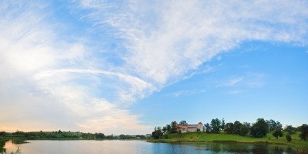 Summer evening view of Svirzh Castle (Lviv Oblast, Ukraine). Built in XV-XVII th century. Two shots stitch image.の写真素材
