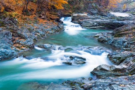 Waterfalls on Rocky Stream, Running Through Autumn Mountain Forest