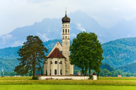 Historic medieval Neuschwanstein Castle in Bavaria (Germany) and church nearのeditorial素材