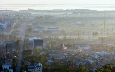 Morning Lviv City (Ukraine) outskirts view from High Castle Hill (in first sun rays back lighting)の写真素材